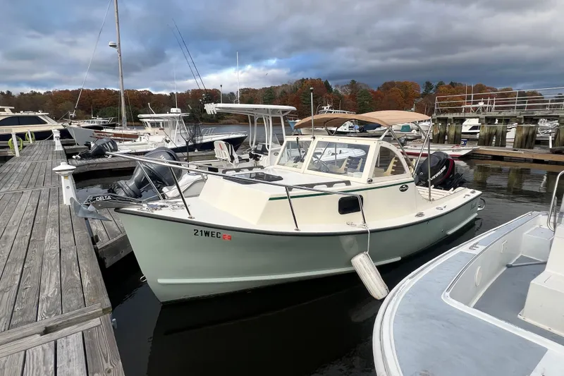 Slide: The Image of 2018 Seaway 21 Seafarer Cuddy docked at a marina with overcast skies. - 9