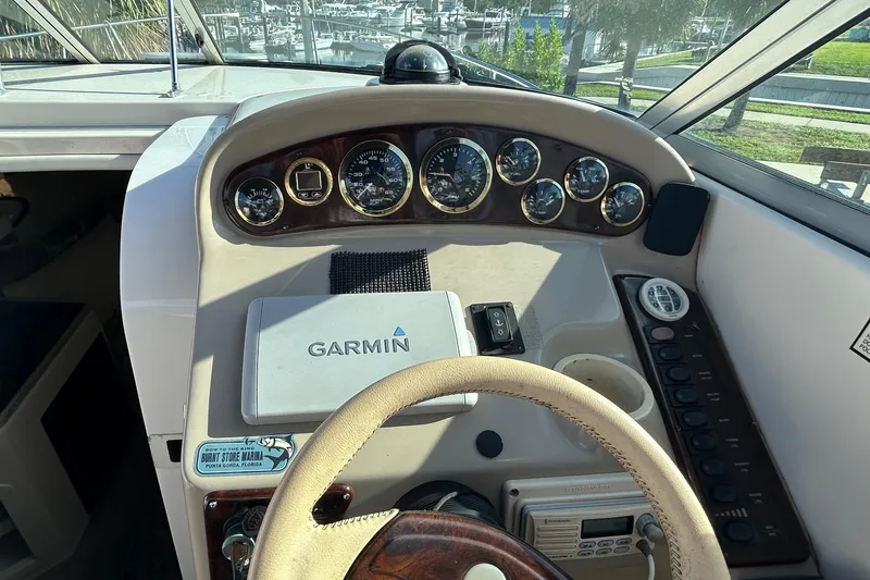Slide: The Image of Cockpit of 2000 Rinker 270 Fiesta Vee with Garmin navigation system and instrument panel. - 12
