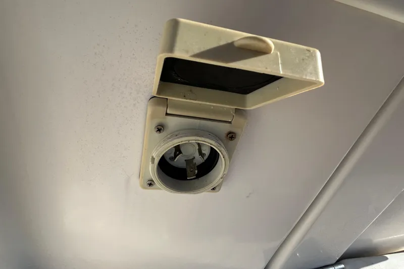 Slide: The Image of Electrical outlet on 2000 Rinker 270 Fiesta Vee boat ceiling. - 25