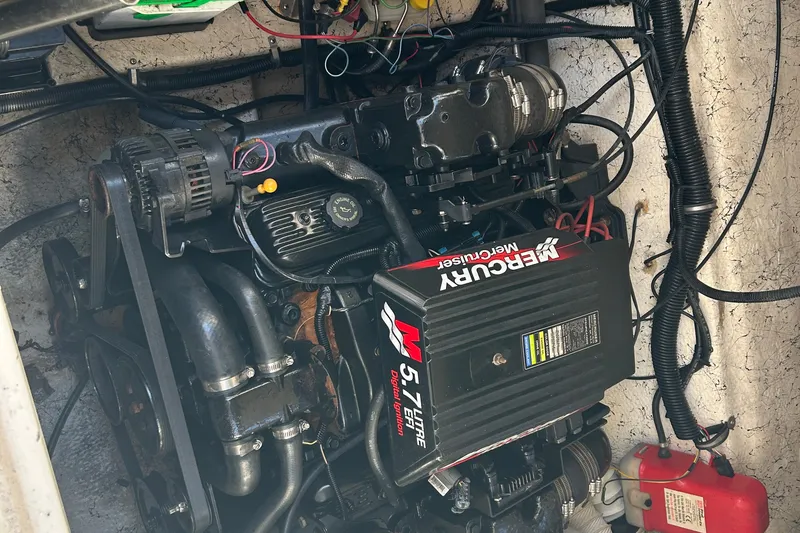 Slide: The Image of Engine compartment of a 2000 Rinker 270 Fiesta Vee with a Mercury 5.7L engine. - 33
