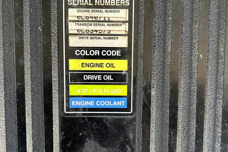 Slide: The Image of Label with serial numbers and color codes for fluids on a 2000 Rinker 270 Fiesta Vee. - 34