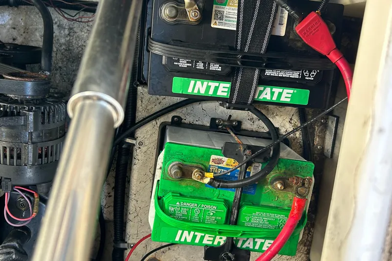 Slide: The Image of Battery compartment of a 2000 Rinker 270 Fiesta Vee with Interstate batteries. - 35