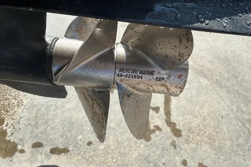 Slide: The Image of Close-up of a Mercury Marine propeller on a 2000 Rinker 270 Fiesta Vee boat. - 37
