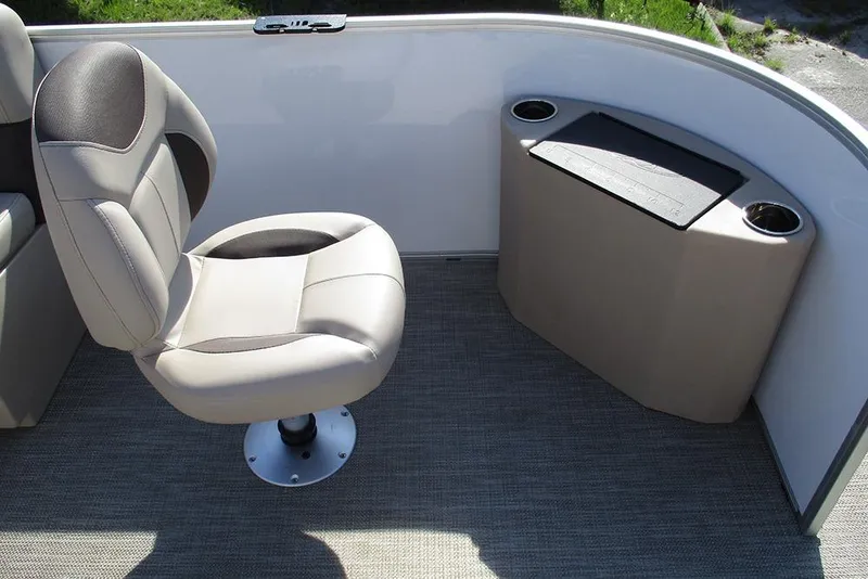 Slide: The Image of 2026 Bentley Pontoons 243 Fish CWT interior with swivel chair and storage compartment. - 11