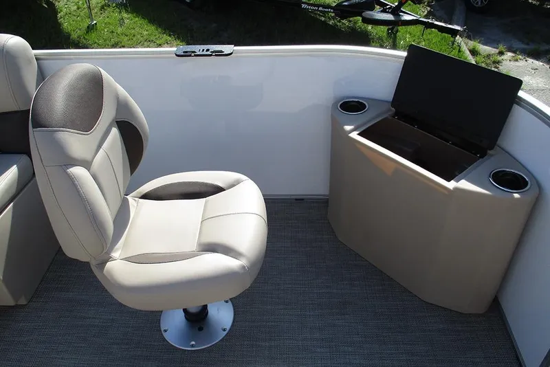 Slide: The Image of 2026 Bentley Pontoons 243 Fish CWT interior with swivel chair and storage compartment. - 12