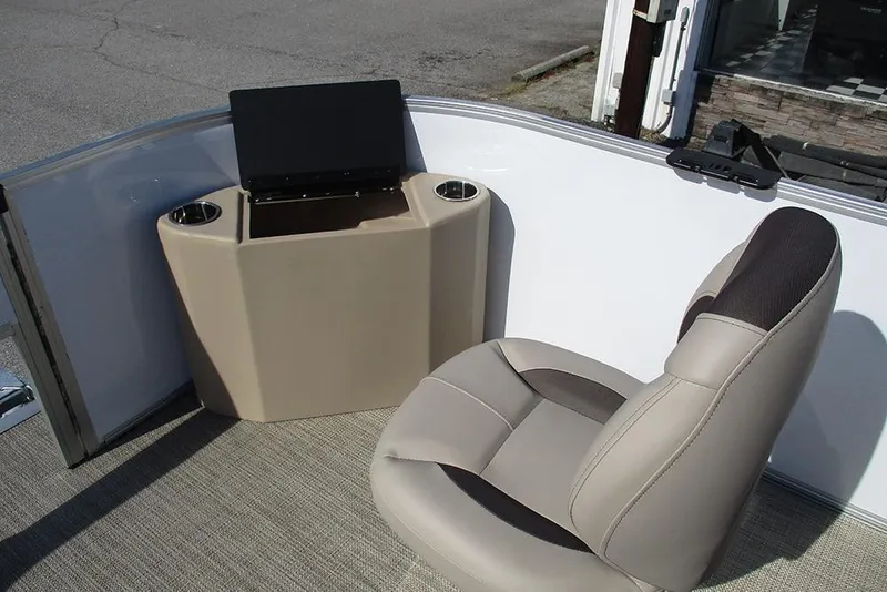 Slide: The Image of 2026 Bentley Pontoons 243 Fish CWT interior with beige seating and console. - 15