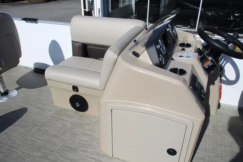 Slide: The Image of 2026 Bentley Pontoons 243 Fish CWT interior with beige seating and control panel. - 17