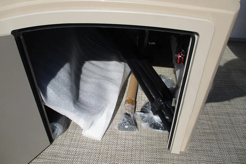 Slide: The Image of Storage compartment of 2026 Bentley Pontoons 243 Fish CWT with wrapped items inside. - 19