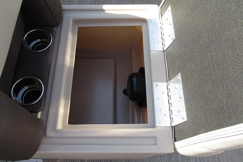 Slide: The Image of Open storage compartment with cup holders on a 2026 Bentley Pontoons 243 Fish CWT. - 23