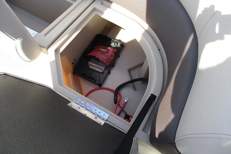 Slide: The Image of Storage compartment in 2026 Bentley Pontoons 243 Fish CWT, featuring battery and wiring. - 27