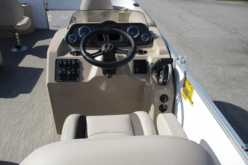 Slide: The Image of 2026 Bentley Pontoons 243 Fish CWT dashboard with steering wheel and controls. - 35