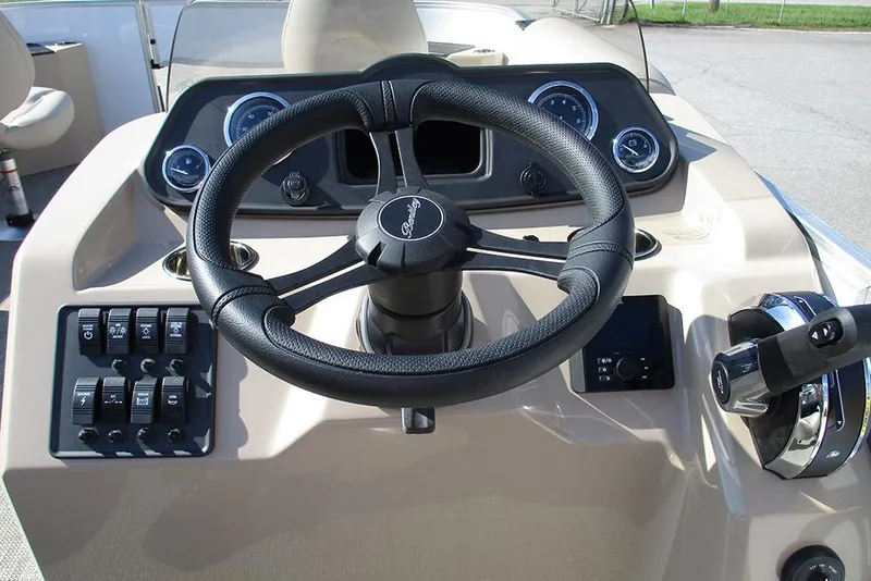 Slide: The Image of Steering console of 2026 Bentley Pontoons 243 Fish CWT with controls and gauges. - 36