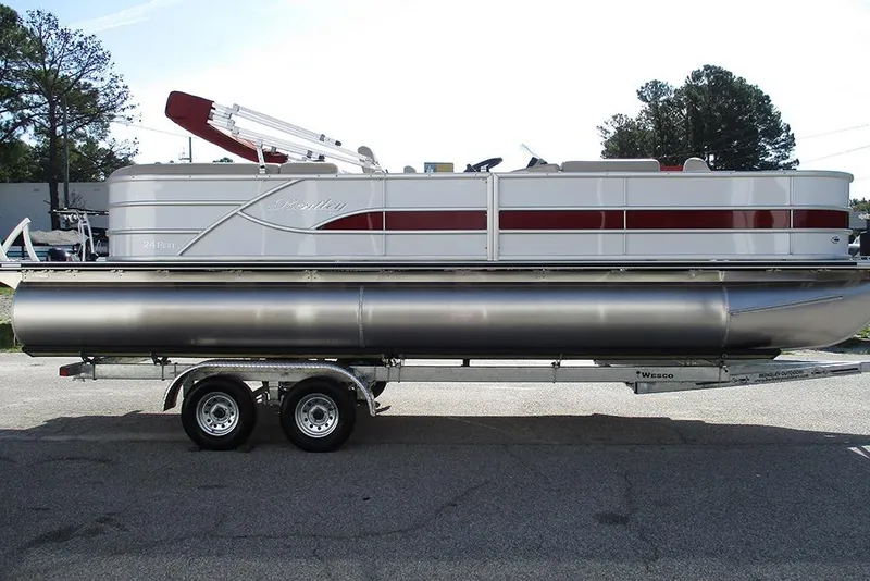 Slide: The Image of 2026 Bentley Pontoons 243 Fish CWT on trailer, side view, outdoors. - 6
