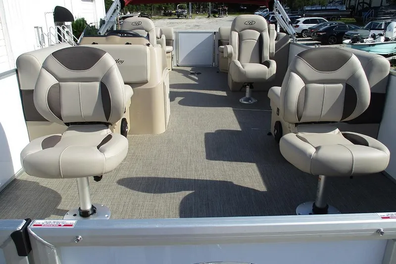 Slide: The Image of 2026 Bentley Pontoons 243 Fish CWT interior with plush seating and spacious layout. - 9