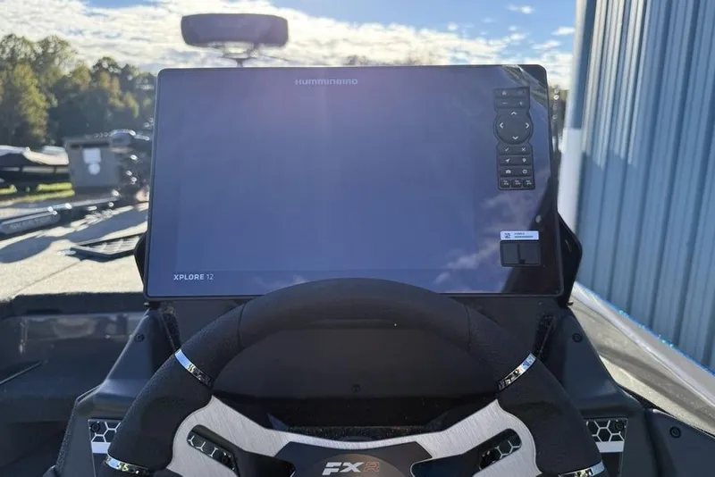 Slide: The Image of 2026 Skeeter FXR20 Apex boat dashboard with Humminbird Xplore 12 display. - 10