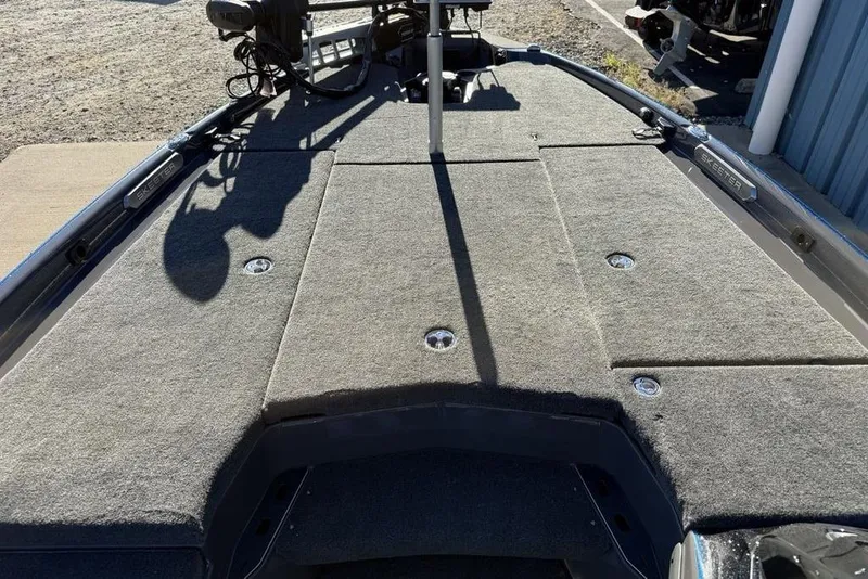 Slide: The Image of 2026 Skeeter FXR20 Apex boat deck with carpeted surface and storage compartments. - 11