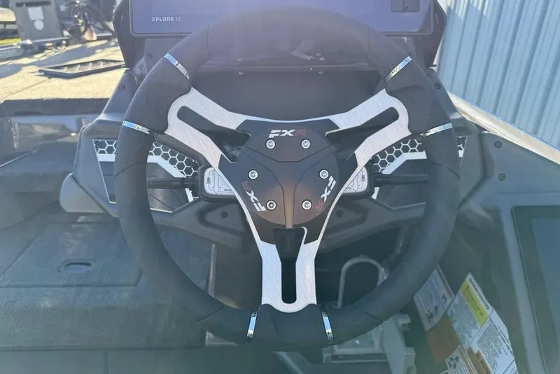 Slide: The Image of Steering wheel of 2026 Skeeter FXR20 Apex boat, featuring modern design and controls. - 15