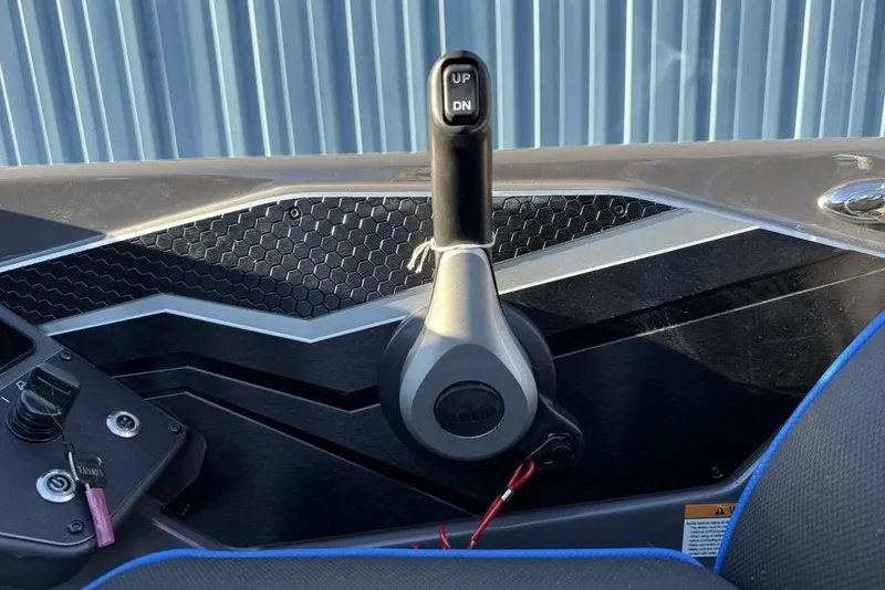 Slide: The Image of 2026 Skeeter FXR20 Apex boat control panel with throttle lever. - 17