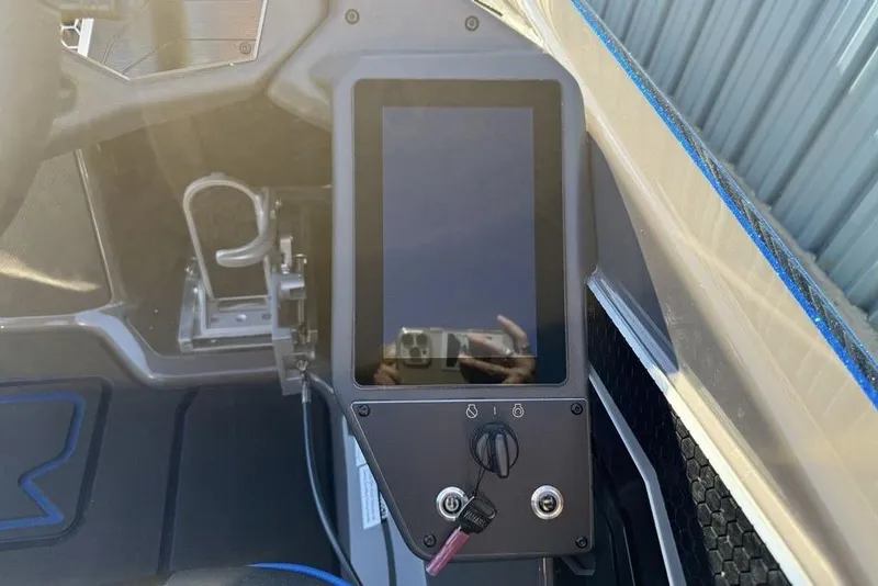 Slide: The Image of 2026 Skeeter FXR20 Apex boat dashboard with touchscreen and controls. - 19