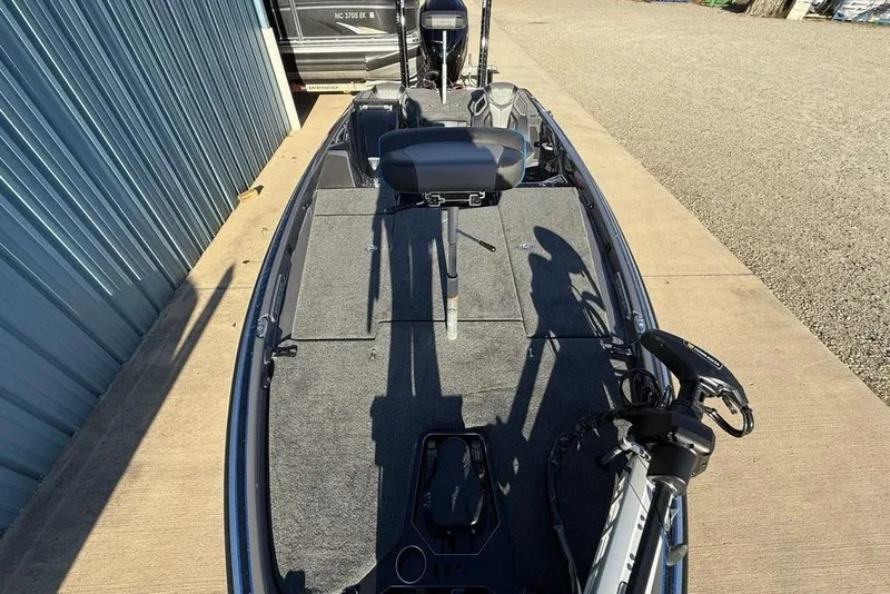 Slide: The Image of 2026 Skeeter FXR20 Apex fishing boat deck with seating and equipment. - 25