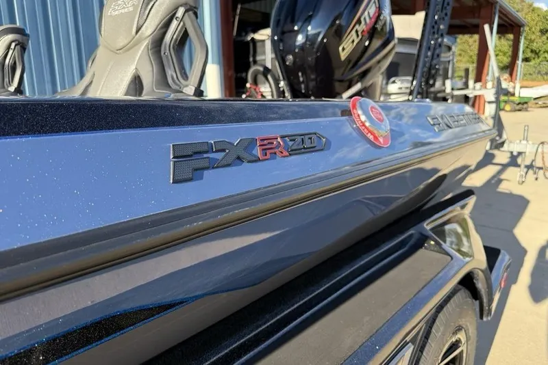 Slide: The Image of 2026 Skeeter FXR20 Apex boat, close-up of logo and sleek design. - 5
