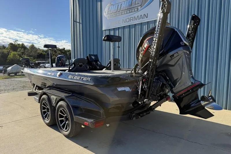 Slide: The Image of 2026 Skeeter FXR20 Apex boat with powerful engine, parked outside a dealership. - 6