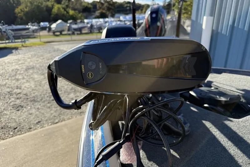 Slide: The Image of 2026 Skeeter FXR20 Apex boat with advanced trolling motor, parked outdoors. - 8