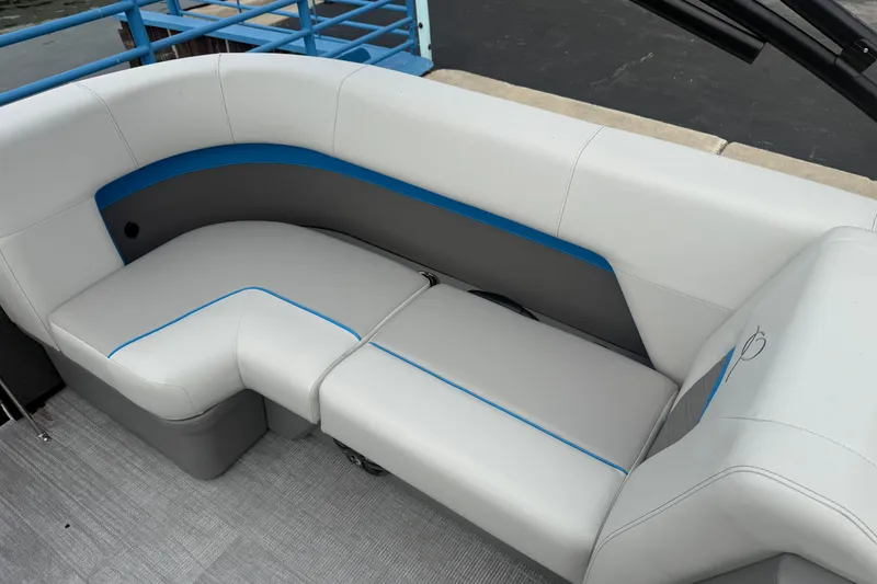 Slide: The Image of Luxurious seating on 2026 Qwest E-CLASS 22 RLS boat, featuring sleek gray and blue upholstery. - 10