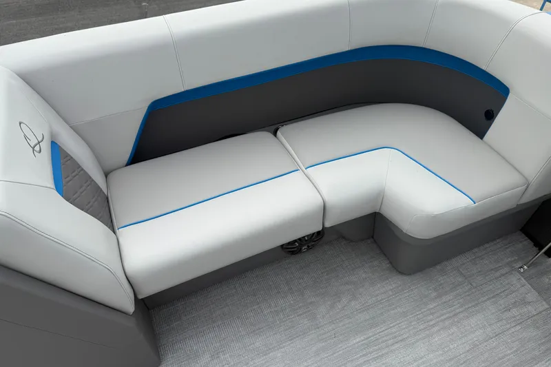 Slide: The Image of 2026 Qwest E-CLASS 22 RLS boat interior seating with modern design and blue accents. - 11