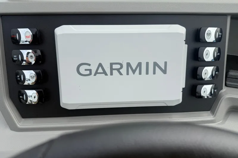 Slide: The Image of Garmin control panel in 2026 Qwest E-CLASS 22 RLS boat dashboard. - 17