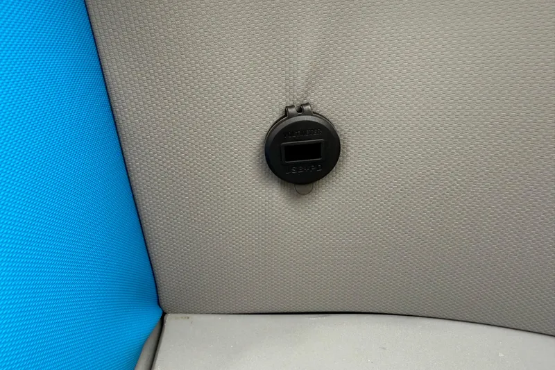Slide: The Image of USB port on 2026 Qwest E-CLASS 22 RLS interior, gray and blue upholstery. - 19