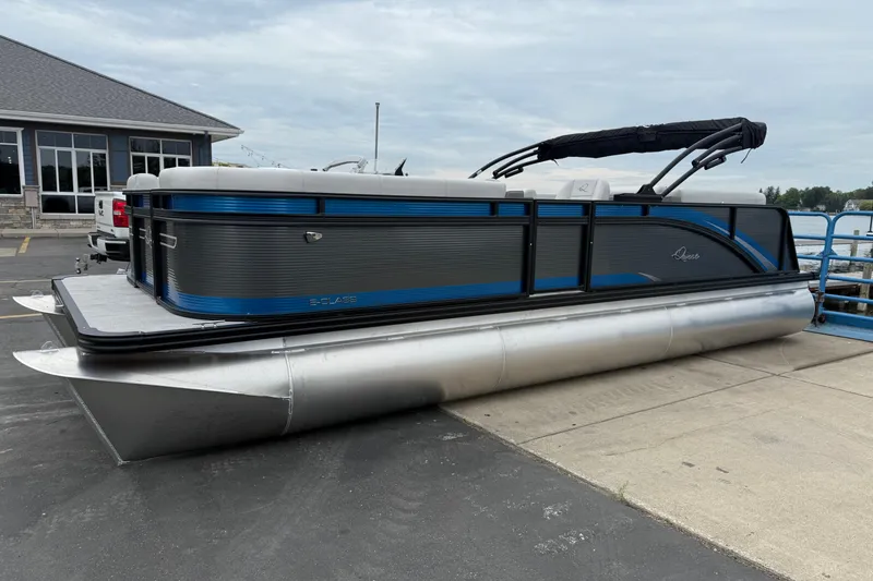 Slide: The Image of 2026 Qwest E-CLASS 22 RLS pontoon boat docked, featuring sleek design and modern amenities. - 4