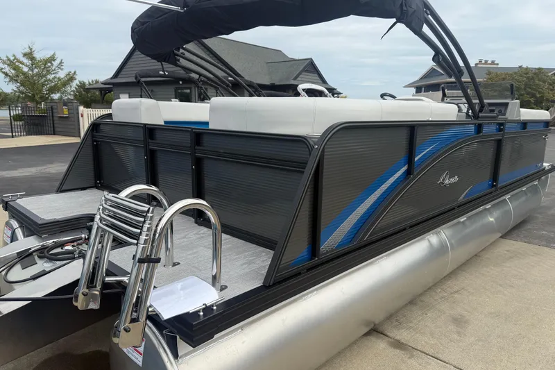 Slide: The Image of 2026 Qwest E-CLASS 22 RLS pontoon boat with sleek design and modern features. - 8