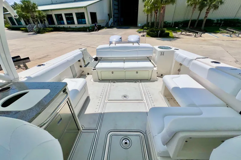 Slide: The Image of 2019 Robalo R317 Dual Console boat interior with spacious seating and modern amenities. - 8