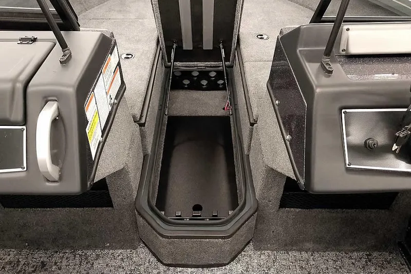 Slide: The Image of 2026 Ranger VX1988 WT boat interior with storage compartments and gray carpeting. - 12