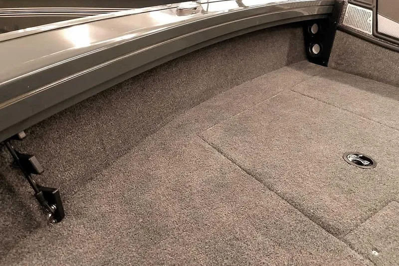Slide: The Image of 2026 Ranger VX1988 WT boat interior with carpeted flooring and storage compartment. - 19