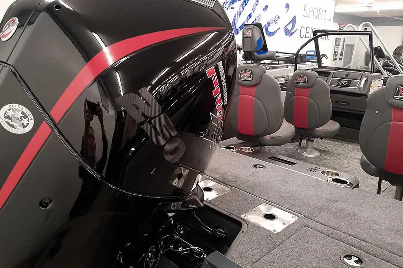 Slide: The Image of 2026 Ranger VX1988 WT boat interior with Mercury Pro engine and seating. - 2