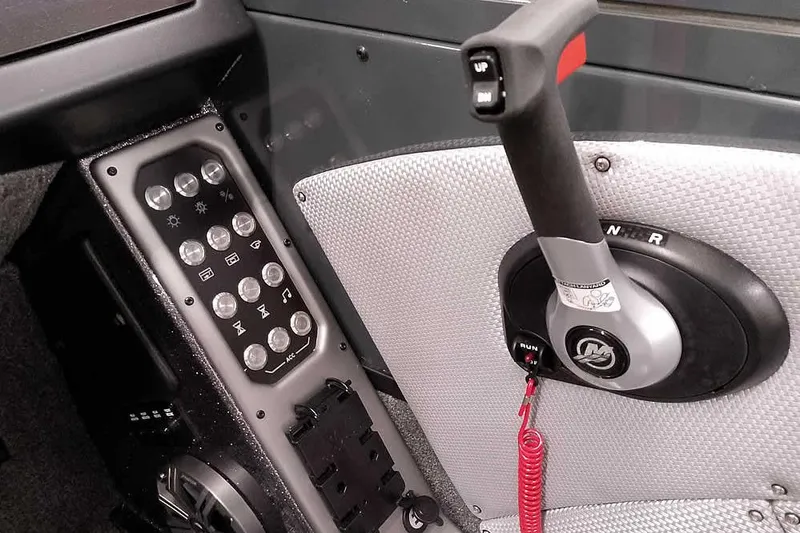 Slide: The Image of Control panel and throttle of 2026 Ranger VX1988 WT boat, featuring buttons and lever. - 28