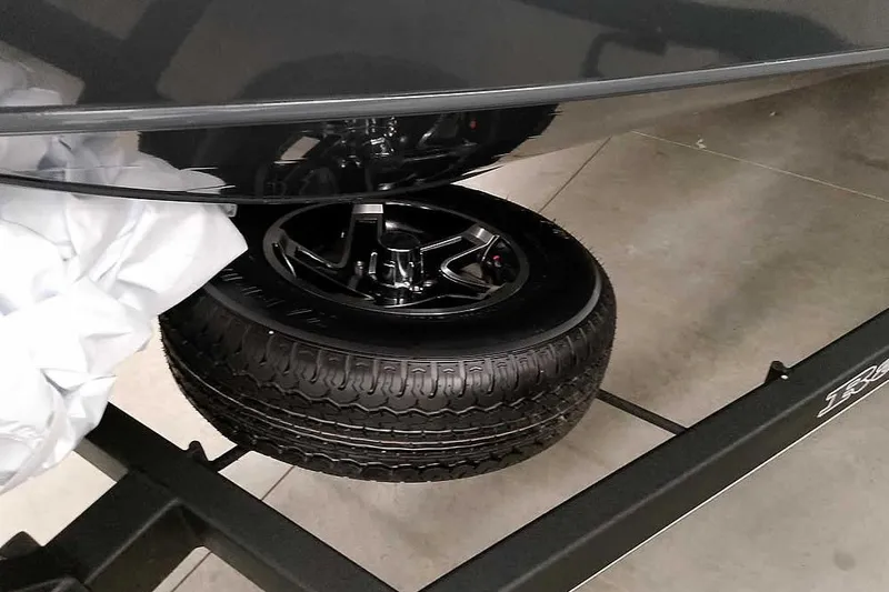 Slide: The Image of 2026 Ranger VX1988 WT boat trailer with spare tire and sleek black finish. - 7