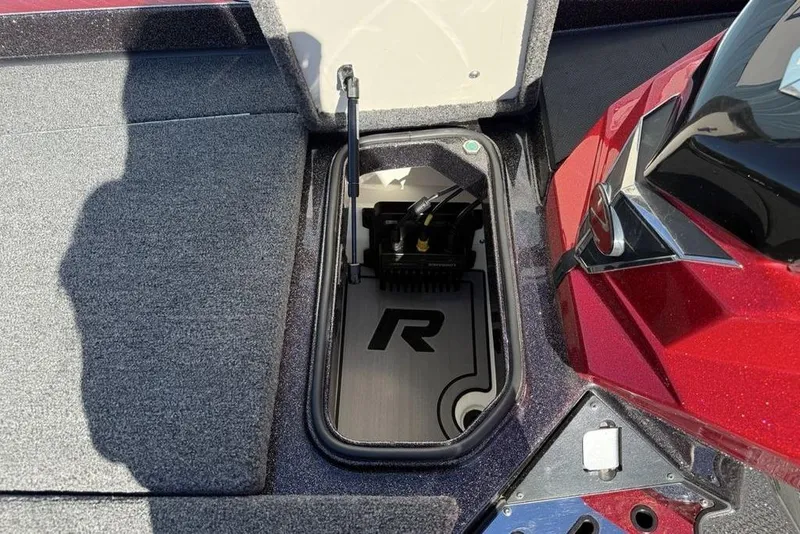 Slide: The Image of 2023 Ranger Z520R Ranger Cup Equipped boat storage compartment, open lid, red and gray interior. - 13