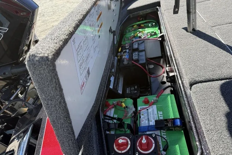 Slide: The Image of 2023 Ranger Z520R Ranger Cup Equipped boat battery compartment with wiring and components. - 27