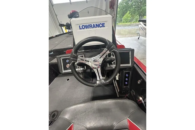 Slide: The Image of 2023 Ranger Z520R boat with Ultrex i-Pilot trolling motor in a marina setting. - 6