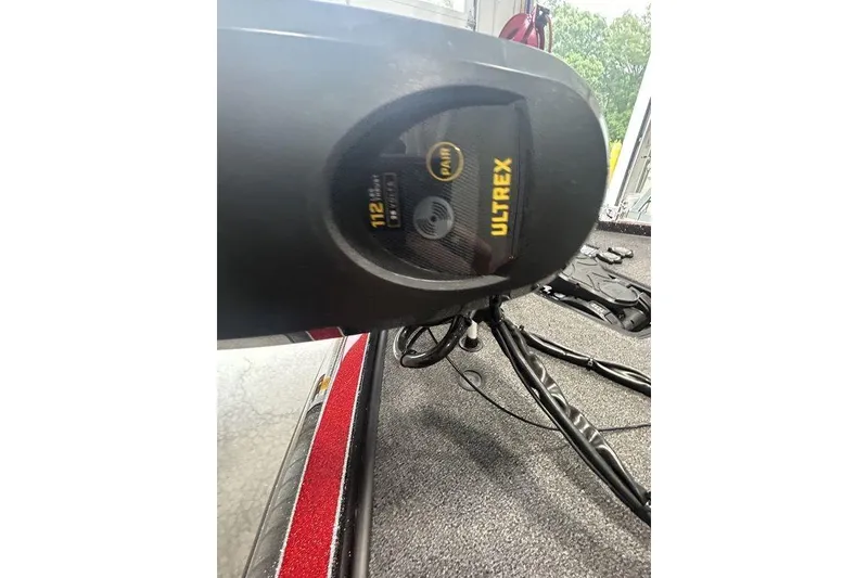 Slide: The Image of 2023 Ranger Z520R Ranger Cup boat deck with gray carpet and storage compartments. - 9