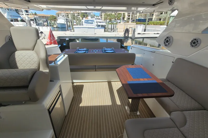 Slide: The Image of Luxurious interior of 2025 Makai M37 yacht with elegant seating and wooden table. - 13