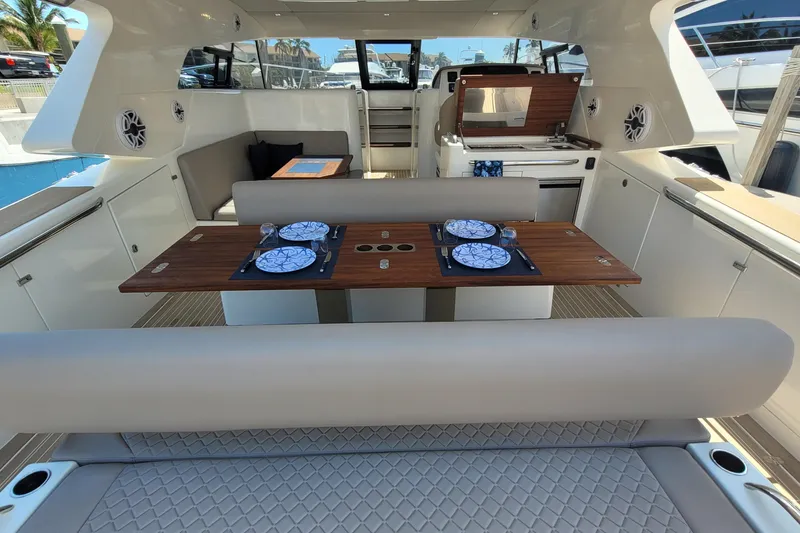 Slide: The Image of 2025 Makai M37 yacht interior with elegant dining setup and modern amenities. - 15
