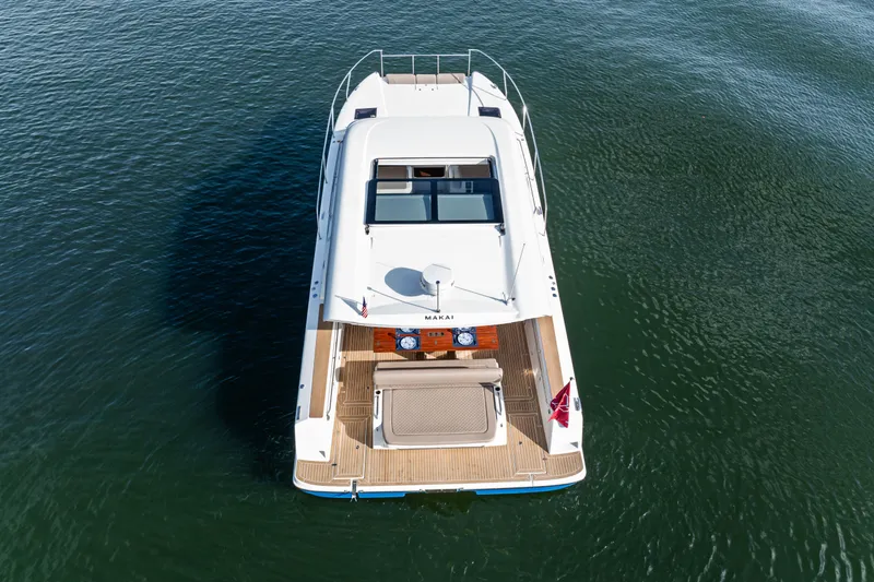 Slide: The Image of Aerial view of 2025 Makai M37 yacht on calm water. - 20