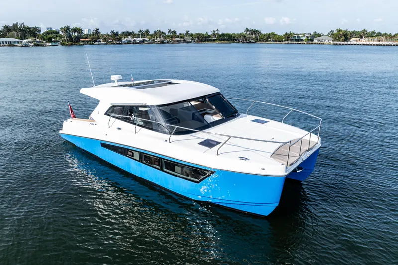 Slide: The Image of 2025 Makai M37 yacht cruising on calm waters, showcasing sleek design and modern features. - 24