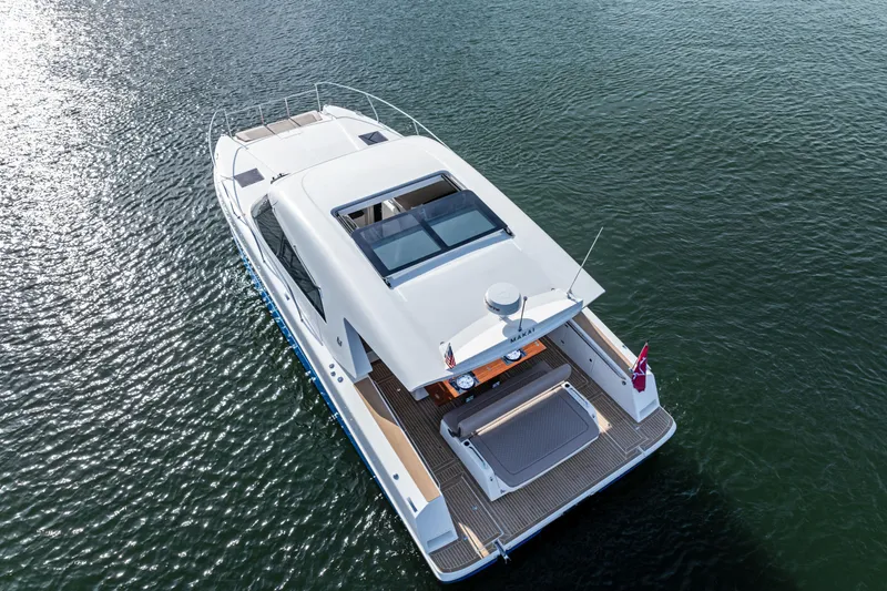 Slide: The Image of 2025 Makai M37 yacht cruising on calm waters, showcasing sleek design and spacious deck. - 28