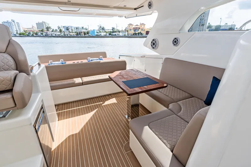 Slide: The Image of Luxurious interior of 2025 Makai M37 yacht with elegant seating and waterfront view. - 39