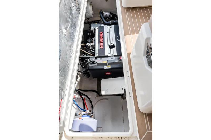 Slide: The Image of Engine compartment of 2025 Makai M37 boat featuring a Yanmar engine. - 52